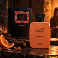 RASASI Hawas Overdose by Rasasi 100ml EDP — Orange perfume bottle and box displayed with dried orange slices and dark wood on a marble surface, with a rocky, warm-toned background.
