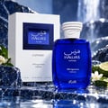 RASASI Hawas Sapphire FB Fragrances Edition by Rasasi 100ml EDP — Blue glass perfume bottle and white box with blue label, set against a watery, rocky background with lime and white flowers.