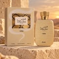 RASASI Hawas Viper by Rasasi 100ml EDP — Botol dan kotak bertekstur emas dengan motif ular, diletakkan di atas blok batu kasar dengan latar belakang matahari terbenam gurun.