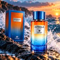TADangel Intrigue Aquatic by TadAngel 100ml EDP Unisex — Botol minyak wangi dan kotak di atas batu basah dengan ombak laut dan latar matahari terbenam