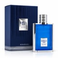 Khadlaj Karus Blu Spice 100ml EDP Men — A blue ribbed glass perfume bottle with a silver cap and silver trim, next to its matching dark blue textured box with silver stripes and a silver label.