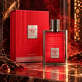 Karus Oud Fire by Khadlaj — Red textured box and matching red ribbed glass perfume bottle with silver cap, set on a marble surface with oud wood and saffron threads.