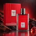 Khadlaj Karus Oud Fire — Red textured box and matching red ribbed bottle with silver cap, set against dark rocks and wood with a fiery red background.