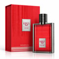 Karus Oud Fire by Khadlaj — Red textured box and glass perfume bottle with silver accents and ribbed black cap, featuring silver labels with brand and product name.