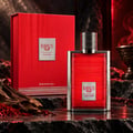 Karus Oud Fire by Khadlaj — Red textured box and red ribbed glass perfume bottle with silver cap, set on dark textured surface with oud wood and saffron strands.