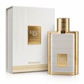 Karus Secret Musk by Khadlaj — White textured box with gold accents next to a gold-trimmed perfume bottle with white ribbed detailing and a gold fluted cap.