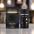 Lattafa Khalta Blend Of Lattafa Eau De Parfum 100ml — Kotak wangian hitam bertekstur dengan ukiran bergelombang dan botol wangian gelap dengan penutup emas, dipamerkan di atas permukaan putih berkilat.
