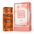 Lattafa Khamrah Mira — Amber-toned perfume bottle with intricate geometric glass cap, set against a soft, warm background with dappled light.