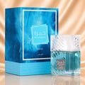 Lattafa Khamrah Waha Lattafa Perfumes 100ml EDP — A blue marbled box and a clear glass perfume bottle with blue liquid and a silver cap, set against a soft gold fabric background. | Lattafa Khamrah Waha Lattafa Perfumes 100ml EDP — Kotak biru bertekstur marmar dan botol minyak wangi kaca jernih dengan cecair biru dan