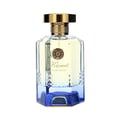 Maison Alhambra Kismet Lunar Magic 100ml — Clear glass perfume bottle with a gold cap and a blue faceted base, featuring a circular emblem and "Kismet Lunar Magic" text. | Botol minyak wangi kaca jernih dengan penutup emas dan tapak biru berfaset, menampilkan lambang bulat dan teks "Kismet Lunar Magic".