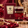 Maison Alhambra Last Night in Paris — Red Eau de Parfum bottle and box with gold accents, displayed with a red rose, pearls, and a gold tray.