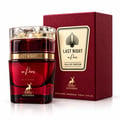Maison Alhambra Last Night in Paris — Red glass perfume bottle with gold accents and a clear faceted cap, next to its matching red textured box with a gold label.
