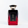 Bujairami Madness by Bujairami 100ml EDP — A faceted glass perfume bottle with a gradient from black to red, featuring a gold cap and a black label with gold text and a crown logo.