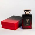 Bujairami Madness by Bujairami 100ml EDP — Red and black gradient box next to a faceted dark red glass perfume bottle with a gold cap, white background