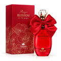 TADangel Magic Blossom by TADangel 100ml EDP Women — Red perfume bottle with a large red satin bow and crystal cap, next to a matching red gift box with gold floral pattern.