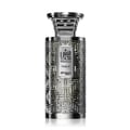 Zimaya Modhesh Noble 100ml by Zimaya — A metallic silver perfume bottle with an intricate geometric pattern and Arabic calligraphy on the label, set against a white background. | Zimaya Modhesh Noble 100ml by Zimaya — Botol minyak wangi perak metalik dengan corak geometri yang rumit dan kaligrafi Arab pada label