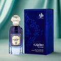 Al Wataniah Muheeb Perfume Man by Al Wataniah 100ml — A dark blue glass perfume bottle with a gold cap sits next to its matching dark blue velvet box with embossed floral patterns. | Al Wataniah Muheeb Perfume Man by Al Wataniah 100ml — Botol kaca biru gelap dengan penutup emas terletak di sebelah kotak baldu biru