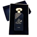 Lattafa Musk Al Aroos by Lattafa 80ml EDP — A dark blue perfume bottle with gold Arabic calligraphy and 'MUSK AL AROOS' text, presented in an open dark blue gift box with a gold trim. | Lattafa Musk Al Aroos by Lattafa 80ml EDP — Botol minyak wangi biru gelap dengan kaligrafi Arab emas dan teks 'MUSK AL AROOS'