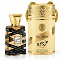 Lattafa Oud Mood 30ml EDP Unisex — Gold-capped perfume bottle with black ribbon wrap, next to a matching cylindrical gold and cream presentation box with ornate patterns and a gold chain handle.