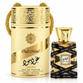 Lattafa Oud Mood 30ml EDP Unisex — Gold ornate cylindrical box with rope handles next to a clear glass perfume bottle with gold cap and black ribbon.