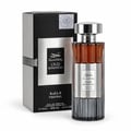 Ard Al Zaafaran Oud Romancea Fakhama — Perfume bottle and box displayed together against a white background. The bottle has a ribbed glass body with amber liquid and a silver cap. The box is black with silver ribbed details and a silver label.