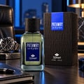 TADangel Pathway by Tad Angel 100ml EDP Men — Glass perfume bottle with textured black cap, blue label, next to embossed black box, luxury watch, and notebook on wooden desk.