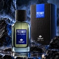 TADangel Pathway by Tad Angel 100ml EDP Men — A glass perfume bottle with a black textured cap and a blue label, placed on wet dark rocks with blue lighting and smoke effects. A matching black box with blue accents is visible.
