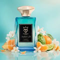 Bujairami Perfect Life by Bujairami Eau de Parfum 100ml — Blue glass perfume bottle with gold cap, surrounded by citrus fruits, ginger, and white flowers on a light blue background.