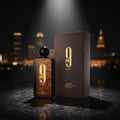 Afnan 9PM Elixir by Afnan 100ml EDP Men — Botol wangian gelap dengan corak oren berjalur dan penutup hitam, berdiri di sebelah kotak coklat berjalur dengan logo emas 9PM Elixir. Latar belakang bandar malam yang malap.