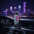 Afnan 9 PM Rebel by Afnan EDP 100 ml Men — Perfume bottle on car dashboard at night with city skyline background