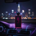 Afnan 9 PM Rebel by Afnan EDP 100 ml Men — Bottle on car dashboard at night with city skyline background