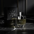 Afnan Rare Carbon by Afnan Perfumes – 100 ml for Men, perfume bottle and box on a marble surface with dark background