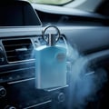 Afnan Supremacy In Heaven by Afnan Perfumes — Blue perfume bottle with silver cap and emblem, emitting smoke, placed in a