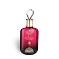 Al Wataniah Sabah Al Ward — Pink gradient glass perfume bottle with gold accents and a faceted crystal stopper, isolated on