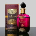 Al Wataniah Sabah Al Ward — Pink gradient glass bottle with gold ornate label and black faceted cap, next to matching box.