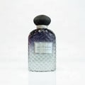 Ard Al Zaafaran Sayaad Al Quloob — Textured glass bottle with gradient purple to clear liquid, black ribbed cap, silver