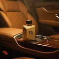 Ard Al Zaafaran Oud 24 Hours Majestic 100ml EDP Man – Ard Al Zaafaran, gold bottle with Arabic script on car console