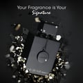 Armaf Club De Nuit Intense Man — Black perfume bottle emerging from shattered black and gold geometric shards, with text