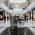 Armaf Club De Nuit Sillage by Armaf 105ml EDP Men — Perfume bottle and box on a reflective surface in a mall.