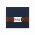 Armaf Tres Nuit — Dark blue box with a brown leather band and silver plaque with "Tres Nuit POUR HOMME" text
