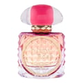 Grandeur Candy Rose – A square glass perfume bottle with pink and orange gradient, featuring a textured diamond pattern on the sides and a circular gold label with "CANDY Rose" text. The cap is clear with pink stripes.