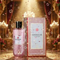 Grandeur Glitz Glam by Grandeur Elite 100 ml for Women — Pink glitter perfume bottle and box with confetti and bubbles falling, luxurious gold and red curtain background.