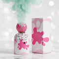 Grandeur Strawberry by Grandeur Tubbees 50ml Woman — Pink cracked sphere cap with mint smoke, white bottle with pink splatter design and cartoon face, next to matching pink splatter box.