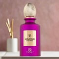 Grandeur Mountain Rose Paris 100ml EDP Grandeur Elite for Her — A matte purple perfume bottle with a gold label and a textured gold cap, set against a blurred pink background with a white vase and gold reeds.