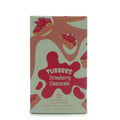 Grandeur Strawberry by Grandeur Tubbees 50ml Woman — A light green box with pink wavy patterns and illustrations of strawberry cheesecake slices.