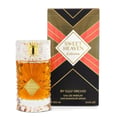 Gulf Orchid Sweet Heaven Extreme — Botol minyak wangi cecair keemasan dengan penutup kaca berhias dan aksen emas, bersebelahan kotak corak geometri hitam dan coralnya.
