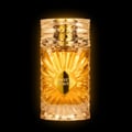Gulf Orchid Sweet Heaven by Gulf Orchid 100ml EDP Unisex — A tall, fluted glass perfume bottle with golden liquid, featuring a diamond-shaped label with 'SWEET HEAVEN' text, against a black background with glowing edges.