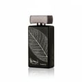 Lattafa Najdia Tribute — Black perfume bottle with a silver leaf imprint and a textured silver cap, set against a white background.