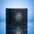 Lattafa Al Dur Al Maknoon Silver 100ml EDP Men — Black box with Arabic calligraphy and text, reflected on a glossy surface