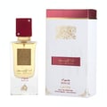 Lattafa Ana Abiyedh Rouge Lattafa 100ml EDP — A clear glass perfume bottle with a red cap and gold accents, alongside its white and red presentation box, both featuring ornate gold detailing.